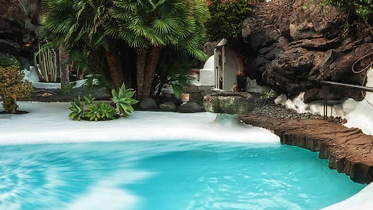 Swimming pool and volcanic bubble oasis at the Cesar Manrique Foundation in Tahiche, Lanzarote